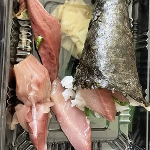 Yellowtail Scallion Roll hand roll full of thick fat strings that you can't bite through and the dark discoloration and mushy texture