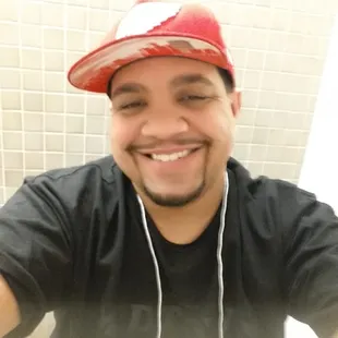 a man taking a selfie in a bathroom