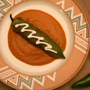 Stuffed New Mexico green chile served with an organic tomato sauce.