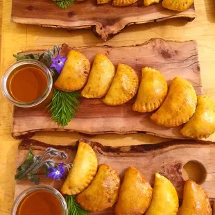 Empanaditas with a guajillo chile and pumpkin seed dipping sauce.