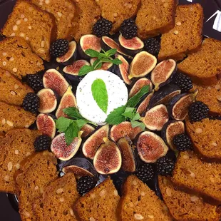Organic pumpkin and piñon nut bread with seasonal fruit and local goat cheese platter.