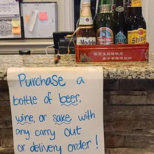 purchase a bottle of beer, wine or sake with any carry out or delivery order