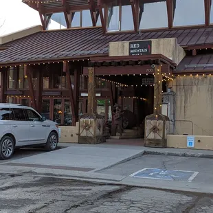 a car parked in front of a restaurant