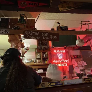 a woman sitting at the bar