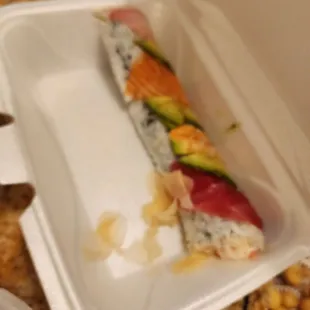 Rainbow Roll. Some kind of weird, pre- made crab salad instead of crab. Leathery looking fish that we didn&apos;t even tr.