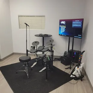 YARG with 2 guitars, microphone, and electric drum set