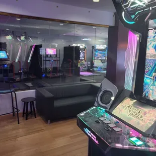 View from inside traditional rhythm game room out to the DDR room