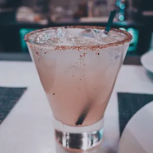 Jalapeño margarita on the rocks with cactus salt rim.