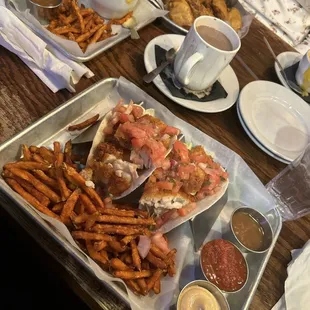 Fish tacos chicken wings Mac n cheese and sweet potato fries