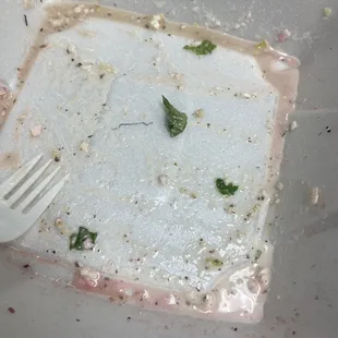 a dirty plate with a fork