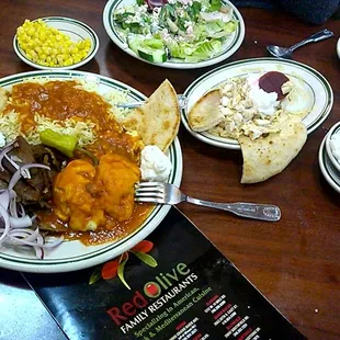 Greek Combo, Greek Salad, Gyro sandwich, Chicken topped Hummus and Toum be Garlic sauce Delicious  Love