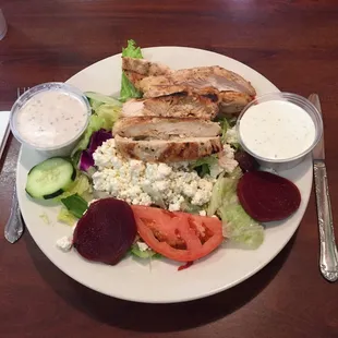 Dinner plate of Greek salad with chicken