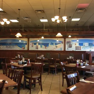 a dining area with tables and chairs