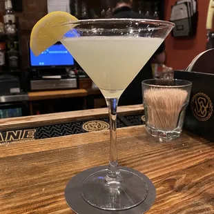a martini with a lemon wedge