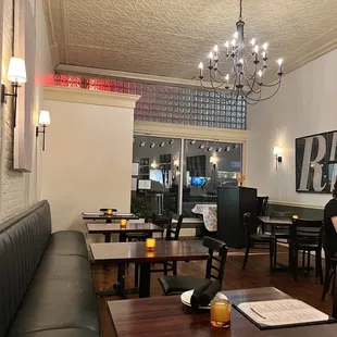a woman sitting at a table in a restaurant