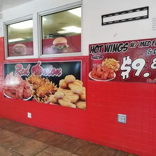  red brick wall with a sign for a fast food restaurant
