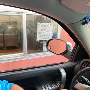 Drive thru sign selling mask and sanitizer
