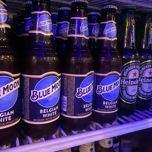 bottles of blue moon beer in a refrigerator
