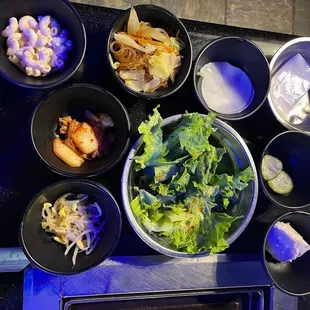 a variety of food in bowls on a table