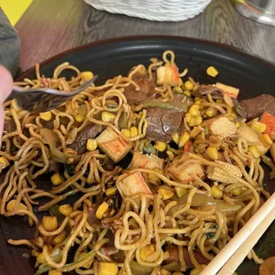 a plate of stir fried noodles