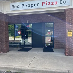 Entrance to the left of Red Pepper Deli