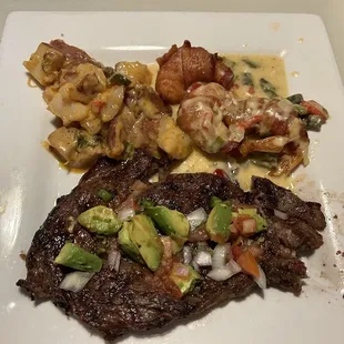 Grilled ribeye steak and bacon wrapped shrimp