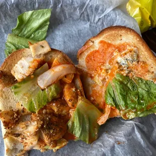 a sandwich with lettuce and tomato