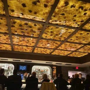 people sitting at a bar