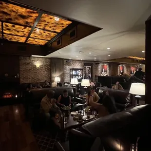 a group of people sitting at a bar