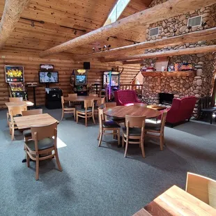 a dining area with tables and chairs