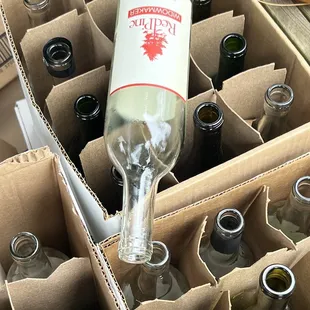 a bottle of wine in a cardboard box