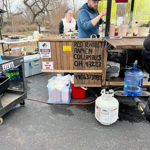 a man standing in front of a cart