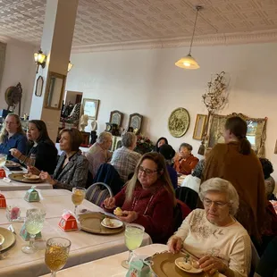 a large group of people sitting at a table