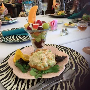 Chicken salad croissant sandwich, fruit salad