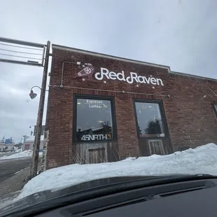 the front of a restaurant with snow on the ground