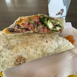 Americano and a breakfast burrito that was freshly made.