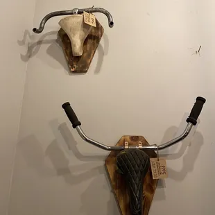 two horns mounted on a wall