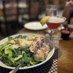 Chicken Cesar salad with a pomegranate martini.