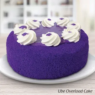 a purple cake with white frosting