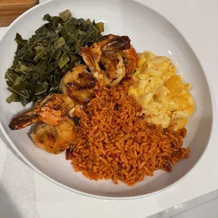 Grilled shrimp with red rice and mac &amp; cheese. Plated at home to show how big the portions are.