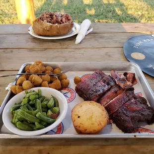 a tray of food on a picnic table