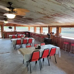 tables and chairs in a rustic setting