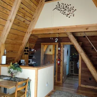 Living Area - Wagon Wheel. For information about this cabin, as well as RRO's other cabin's- please visit redriveroutdoors.com