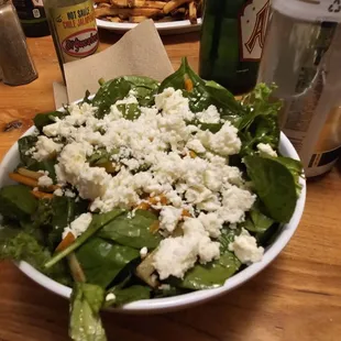 a bowl of spinach and feta salad