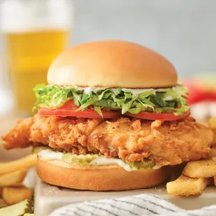 a chicken sandwich with lettuce, tomato, and lettuce