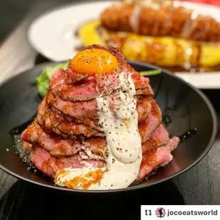 a plate of food with a fried egg on top