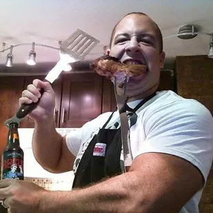 a man with a spatula in his mouth