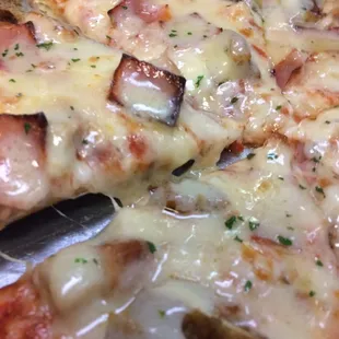 Cordon Blue Pizza smothered with Swiss Cheese