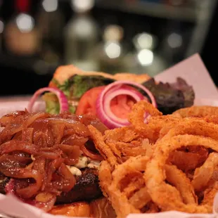 a plate of food with onion rings