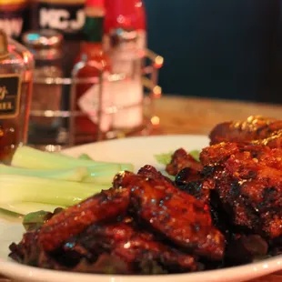 a plate of wings and celery